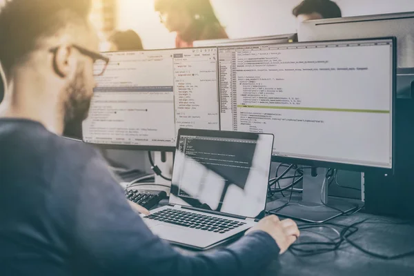 depositphotos_226808220-stock-photo-programmer-working-software-company-office