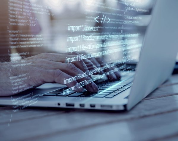 programming-background-with-person-working-with-codes-computer