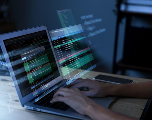programming-background-with-person-working-with-codes-computer(1)
